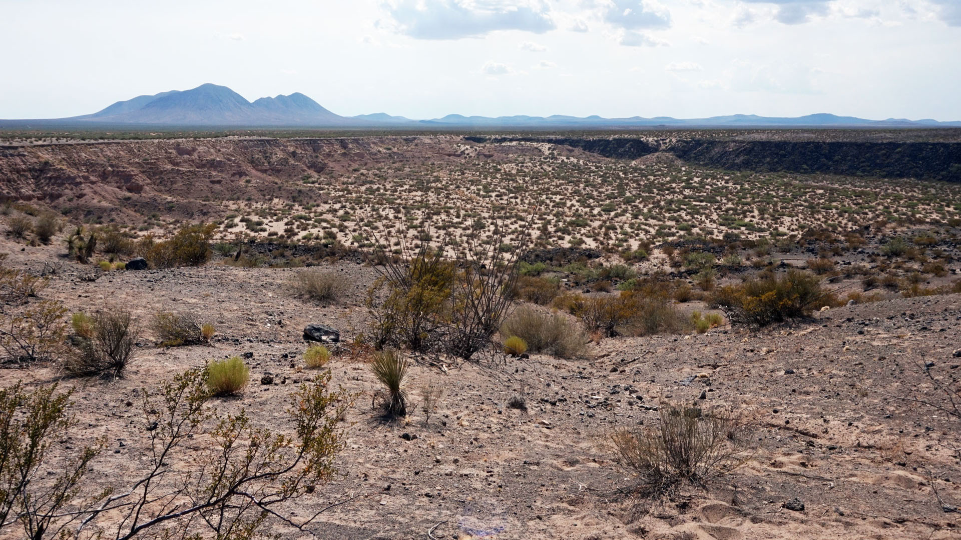 Looking out over the rim of Kilbourne Hole, a maar volcanic crater in southern New Mexico.