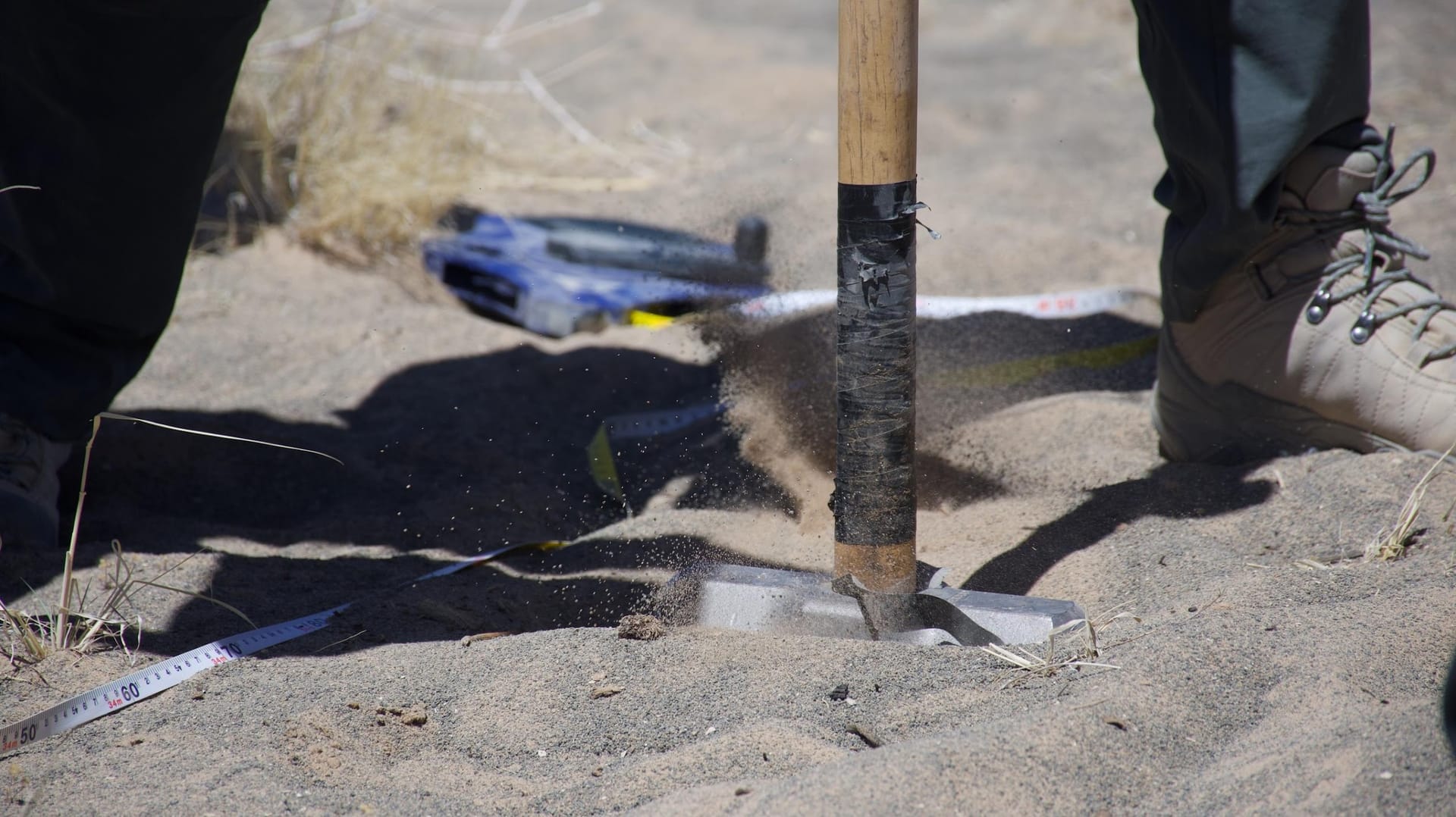 The team trades off making strikes with the hammer, resulting in seismic data.